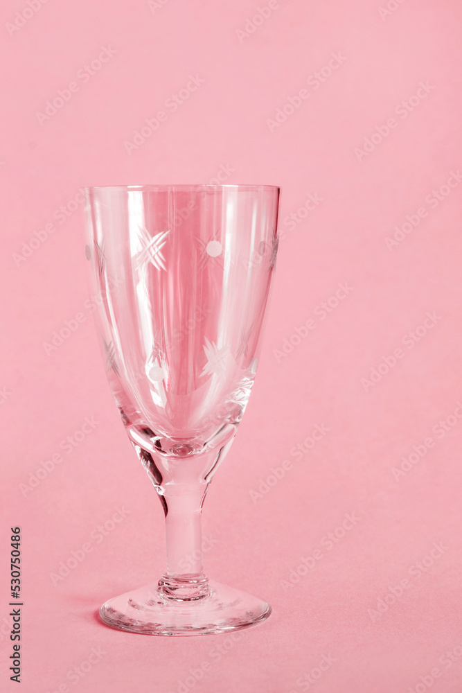 Wineglass on pink background Wineglass on pink background