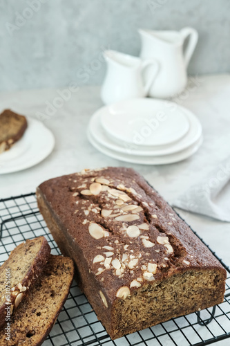Homemade banana bread sliced on cooling rack  close-up  selective focus image. 