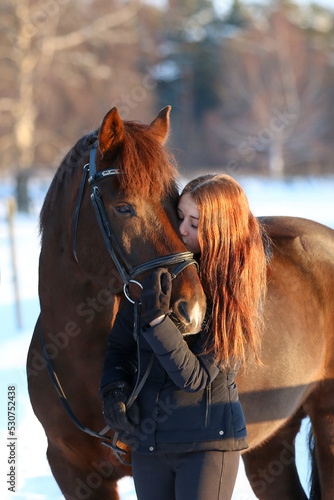A girl and her horse in wintertime, Gotland Sweden.