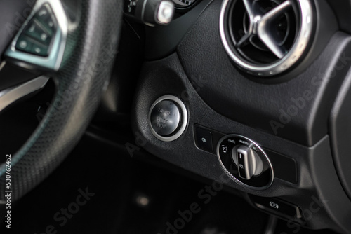 Close up engine car start button. Start stop engine modern new car button,Makes it easy to turn your auto mobile on and off. a key fob unique ,selective focus 