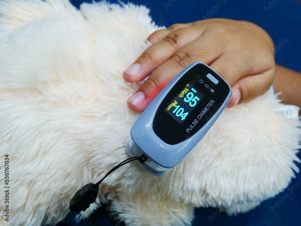 Children use their index finger to measure their oxygen and heart rate