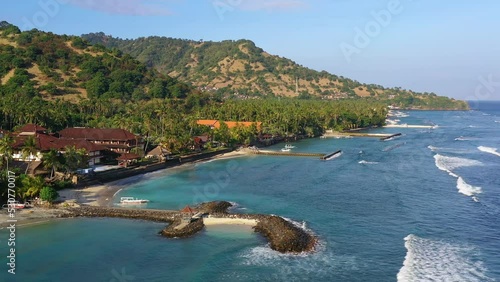Candidasa, Bali: Aerial drone footage of the coast and beach in Candidasa, a resort town in eastern Bali in Indonesia in the Karangasem region.  photo