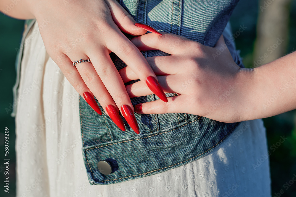 TikTok's latest viral manicure? 'Boston University Red' nails. | Mashable
