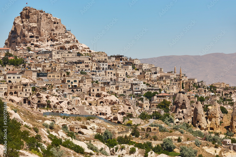 Usichar mountain castle caved in rock. Cappadocia landmark in Turkey
