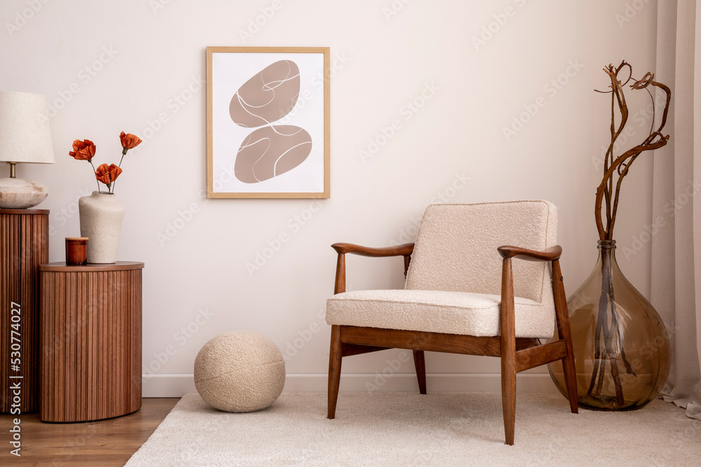 Warm bedroom interior with mock up poster frame, cozy bed, beige bedding,  stylish lamp, round box, black rack, wall with stucco, rattan armchair and  personal accessories. Home decor. Template. Stock Photo