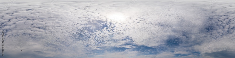 Blue sky with Cumulus clouds Seamless panorama in spherical equirectangular format. Complete zenith for use in 3D graphics, game and for composites in aerial drone 360 degree panoramas as a sky dome