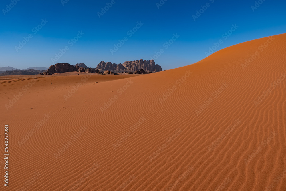 Dunes and patterns in the sand in the Wadi Rum desert, sunny day, Jordan