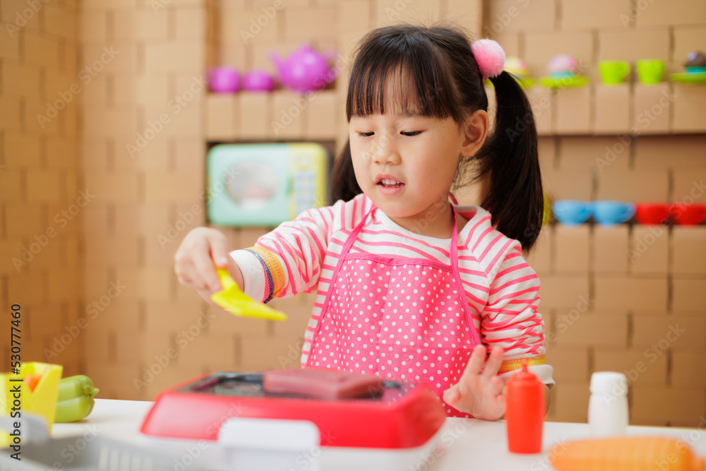 young girl pretend playing food preparing at home young girl pretend playing food preparing at home
