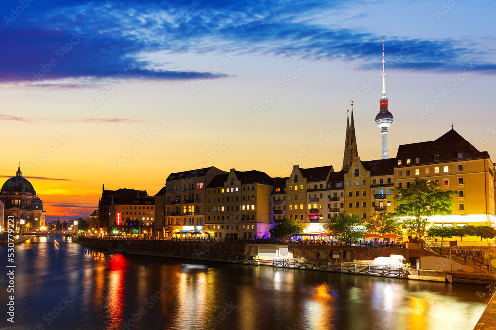 River Spree and the downtown buildings of Berlin, evening lights view, Germany