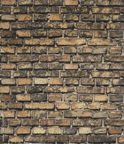 Antique old brown faded brick  closeup brick wall background  texture surface  vertical photography.