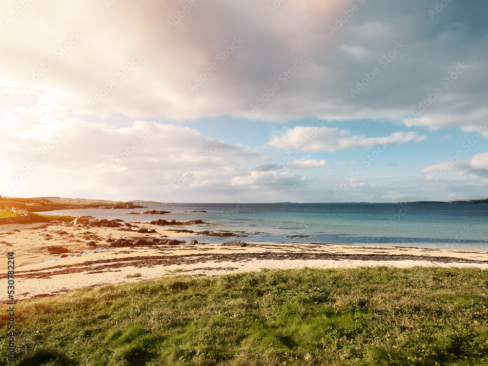 Mannin Bay Blueway beach in county Galway, Ireland. Sandy beach with clear water. Blue cloudy sky. Irish nature landscape Mannin Bay Blueway beach in county Galway, Ireland. Sandy beach with clear water. Blue cloudy sky. Irish nature landscape