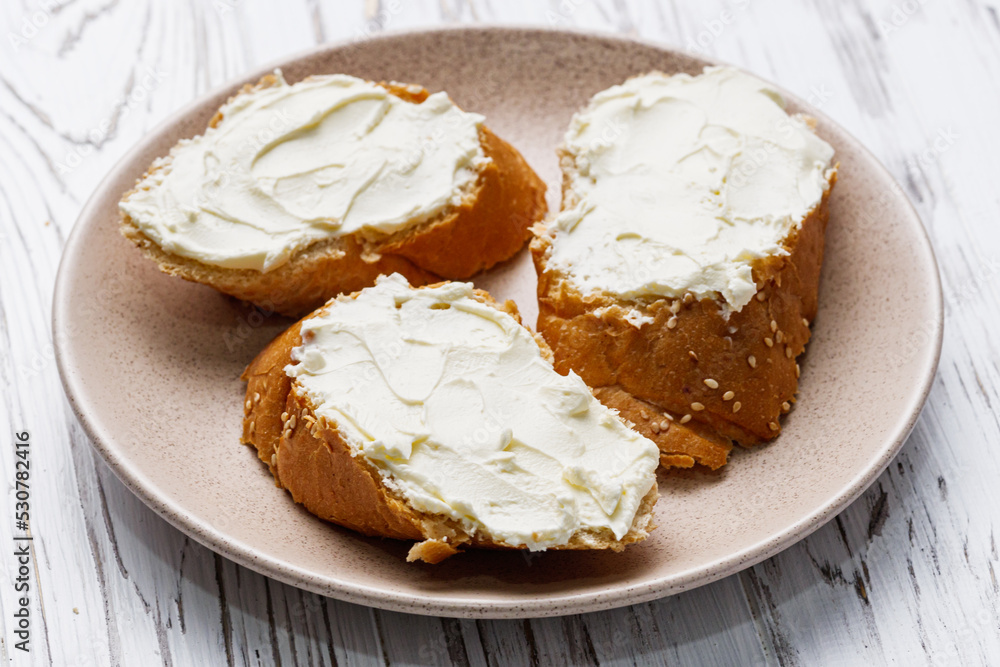 baguette cream cheese sandwich on a white background baguette cream cheese sandwich on a white background