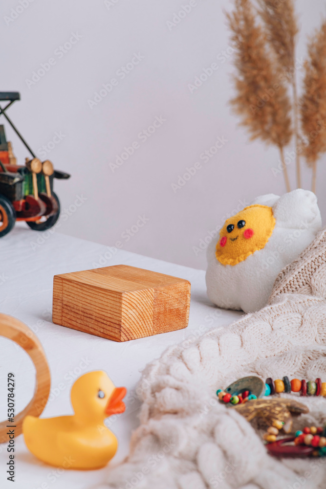 Background with children's things. Composition for the presentation of a product, brand, product. Children's figures.