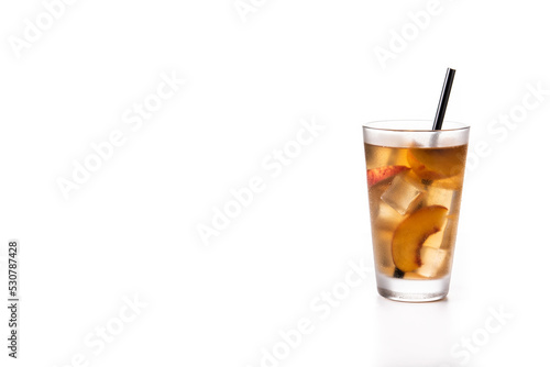 Glass of peach tea with ice cubes isolated on white background