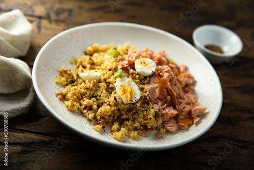 Pilau with salmon and quail eggs