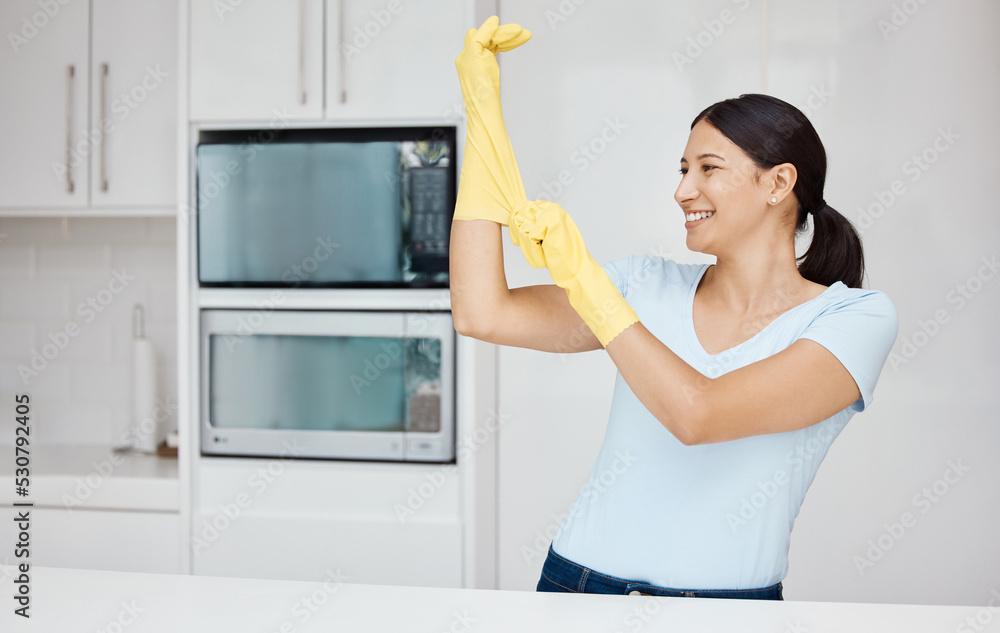 Cleaning, safety and sanitizing with a woman cleaner in rubber gloves ready to do chores and house work. Hygiene, clean and wash with an attractive young female washing her home kitchen with a smile Cleaning, safety and sanitizing with a woman cleaner in rubber gloves ready to do chores and house work. Hygiene, clean and wash with an attractive young female washing her home kitchen with a smile