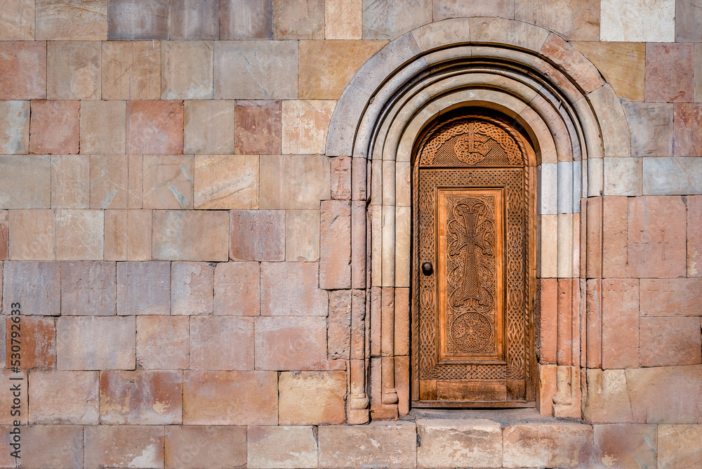 Beautiful Antique Wooden Door in the wall of Noravank Monastery in Armenia
