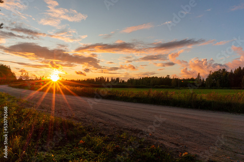 sunset flare on the rural dirt road