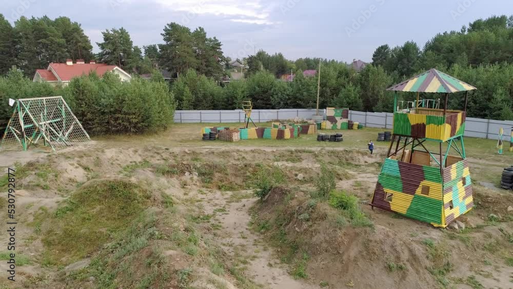 Aerial drone view of Kids having fun playing laser tag outdoor
Aerial drone view of Kids having fun playing laser tag outdoor