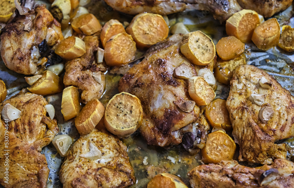 Chicken with sweet potatoes and garlic, baked with mayonnaise in a home oven. Fast kitchen. Chicken with sweet potatoes and garlic, baked with mayonnaise in a home oven. Fast kitchen.