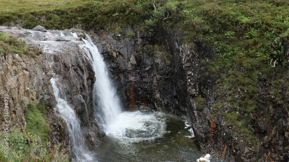 Fairy Pools waterfall in Glen Brittle, Isle of Skye, Scotland, UK with highland midges insects Fairy Pools waterfall in Glen Brittle, Isle of Skye, Scotland, UK with highland midges insects