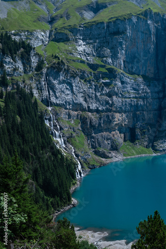 Oeschinensee lake in the Swiss alps on a sunny summer day, Kandersteg