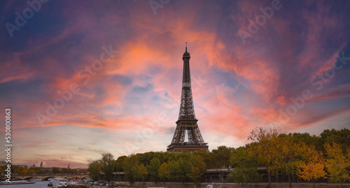 The Eiffel Tower, iconic Paris landmark  as autumn trees park  as Seine river with sunset sky scene in Paris ,France © SASITHORN