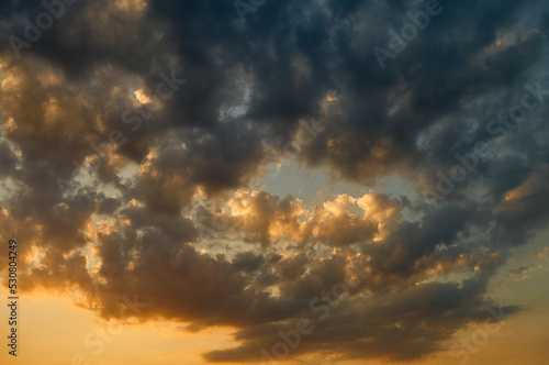 Fototapeta Naklejka Na Ścianę i Meble -  The sky at sunset, clouds of different colors and different shapes, dramatic sky, the beauty of nature, a beautiful landscape of cloudy sky