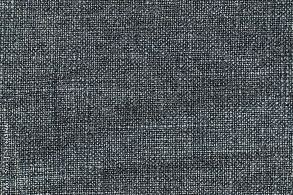 Dark gray denim fabric. Texture background. Close-up. Dark gray denim fabric. Texture background. Close-up.