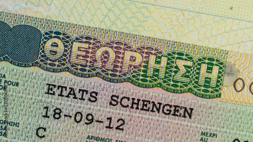 Schengen visa in the passport close-up. 