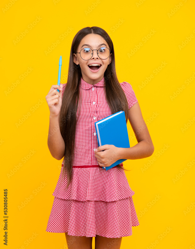 Amazed teen girl. Teenage school girl with books. Schoolgirl student. Excited expression, cheerful and glad. Amazed teen girl. Teenage school girl with books. Schoolgirl student. Excited expression, cheerful and glad.