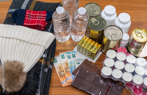 Preparing for a power cut. Basic food to be prepared without electricity, candles, scarves, money,