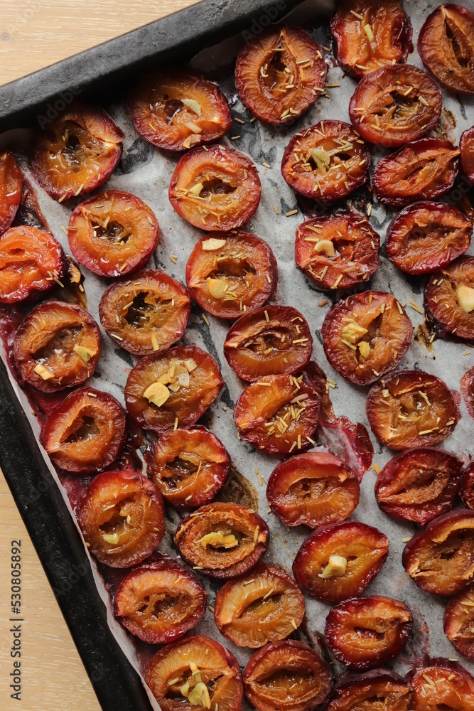 plum dried in the oven with spices and garlic for harvesting for the winter in jars delicacy plum dried in the oven with spices and garlic for harvesting for the winter in jars delicacy