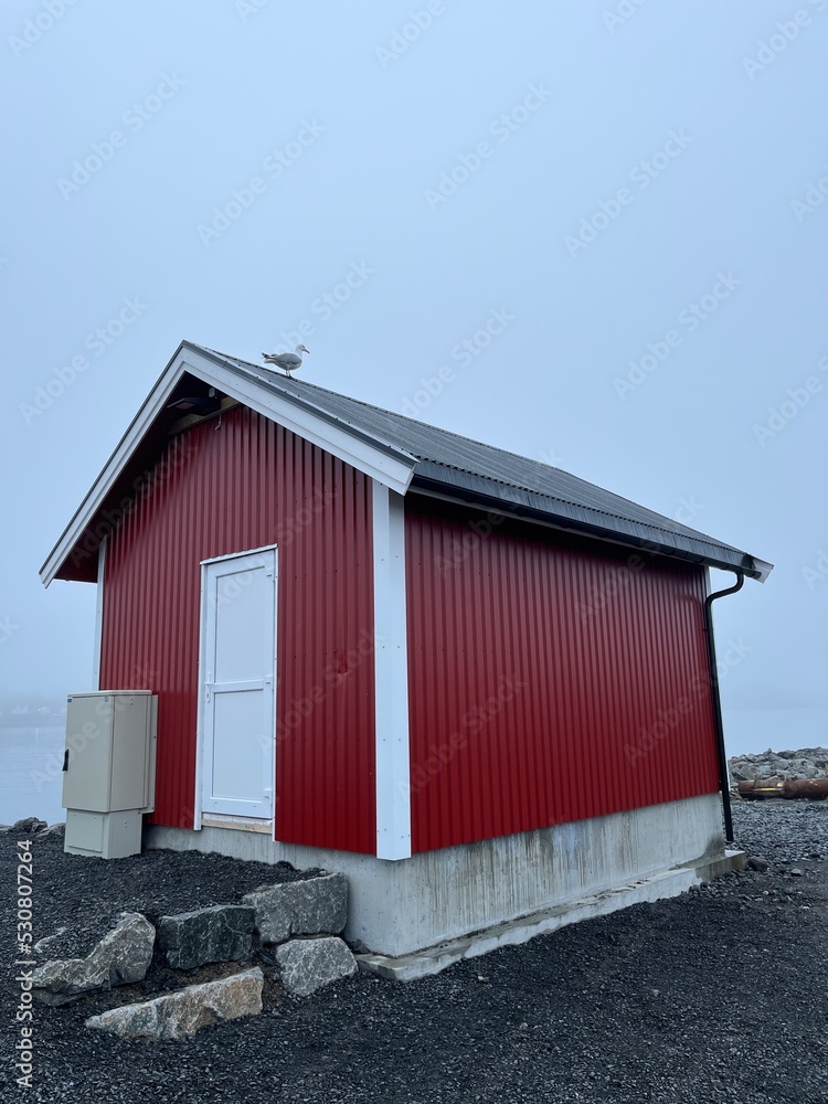 Small fishing house in the fog by the sea Small fishing house in the fog by the sea