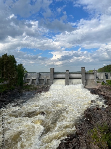 Dam of the river, strong stream of the river  photo