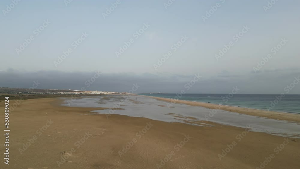 medium altitude flying over beach lagoon towards sea with Africa in background. medium altitude flying over beach lagoon towards sea with Africa in background.
