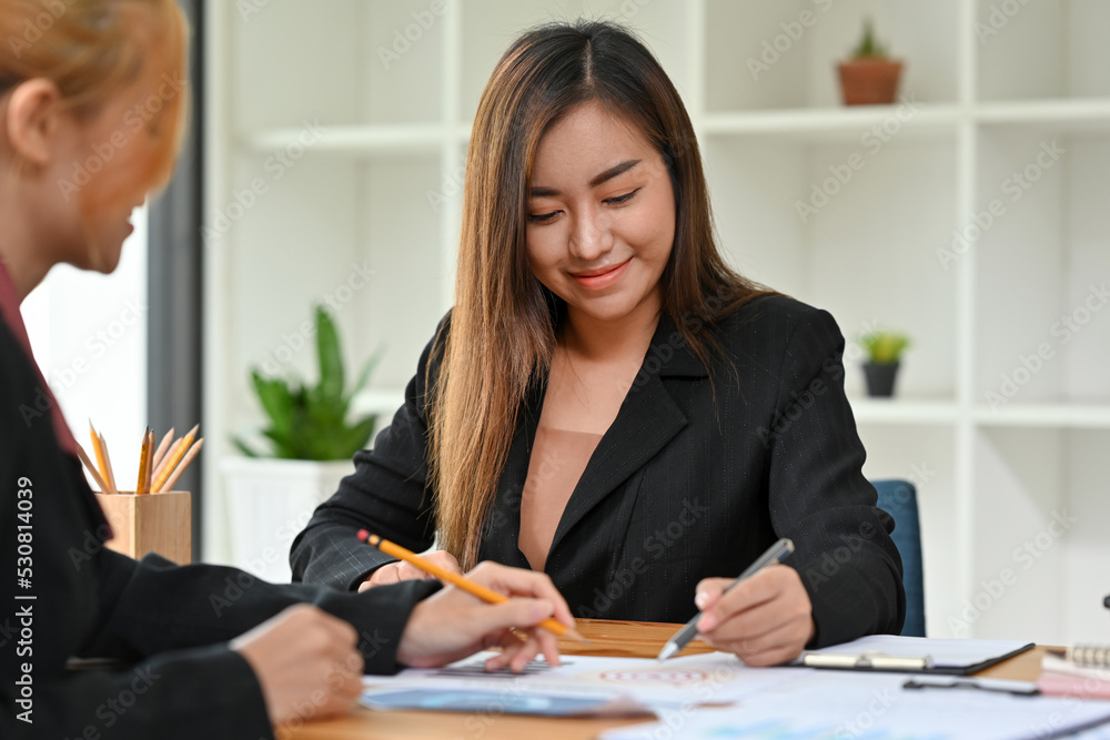 Business planning and Business strategy concept with two businesswomen planning a business strategy. Business planning and Business strategy concept with two businesswomen planning a business strategy.