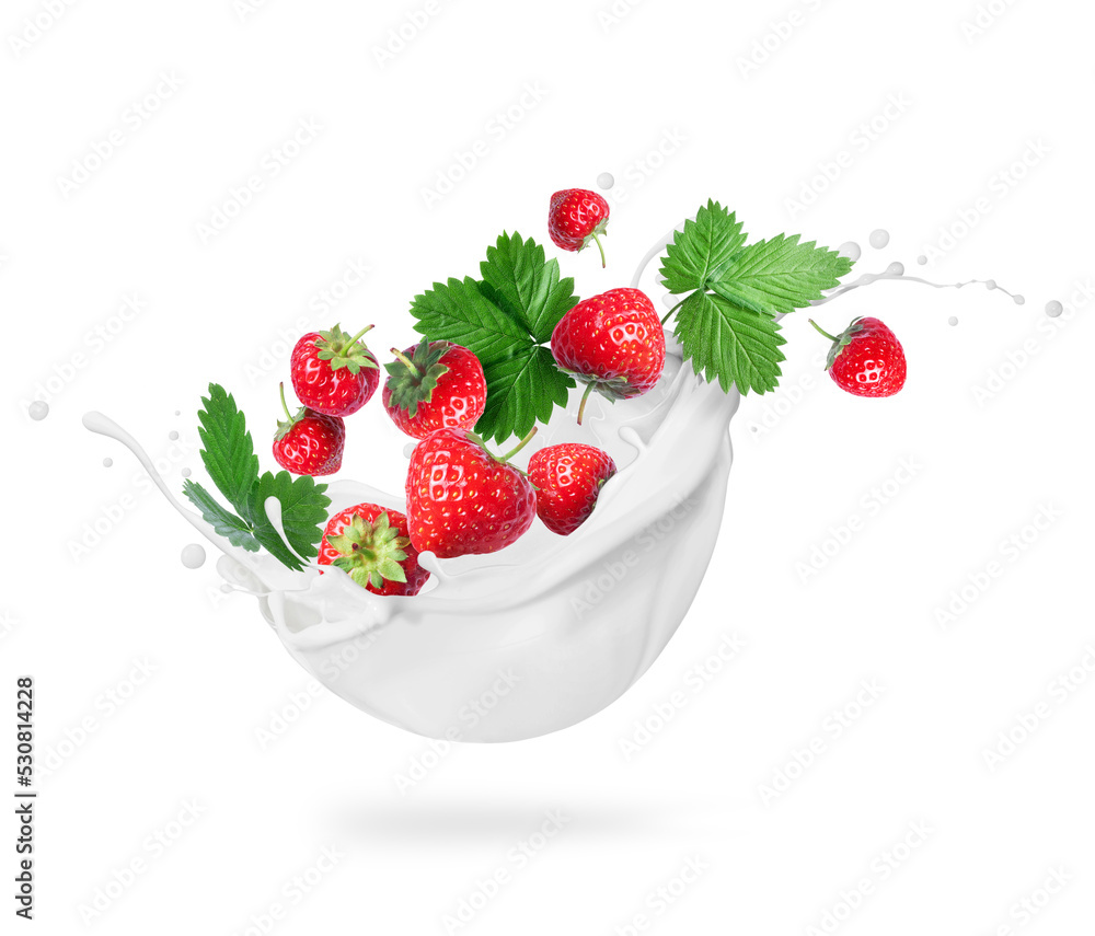 Strawberries with leaves in milk splashes close-up isolated on a white background Strawberries with leaves in milk splashes close-up isolated on a white background