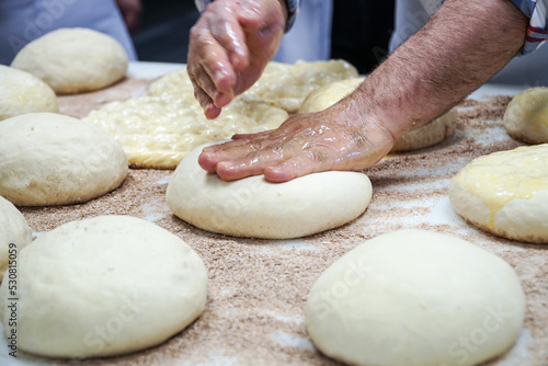 master making dough for bread