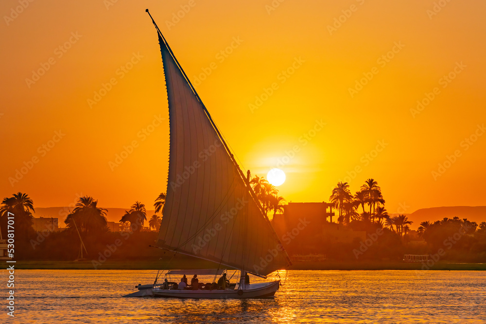 Luxor, Egypt; August 25, 2022 - A Felucca on the Nile in Luxor, Egypt - obrazy, fototapety, plakaty 