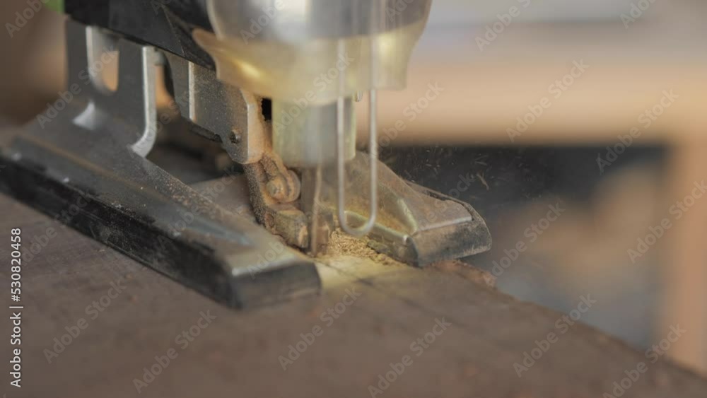 woodworker cutting wood with jigsaw woodworker cutting wood with jigsaw