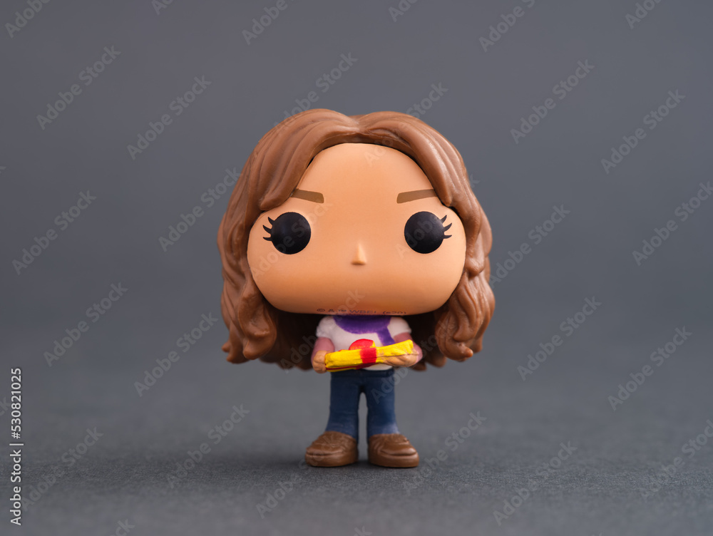Fototapeta premium Tambov, Russian Federation - February 15, 2022 A Hermione Granger Funko POP Mini Vinyl Figure on gray background. Harry Potter Advent Calendar.