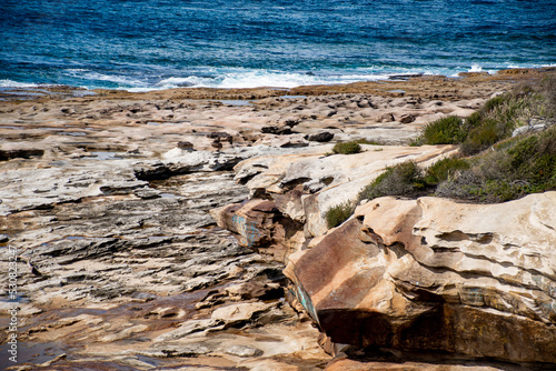 Beautiful ocean and rocky sandstone coastline view. Travel destination. Royal National Park, NSW, Australia. Jibbon Loop Track photo