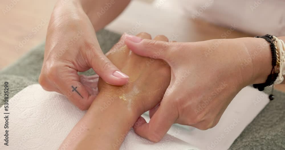 Close up of an unrecognizable young woman enjoying hand massage and manicure in a beauty spa salon. Close up of an unrecognizable young woman enjoying hand massage and manicure in a beauty spa salon.