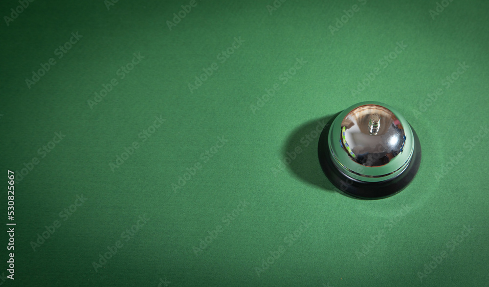 Service bell on the green background.