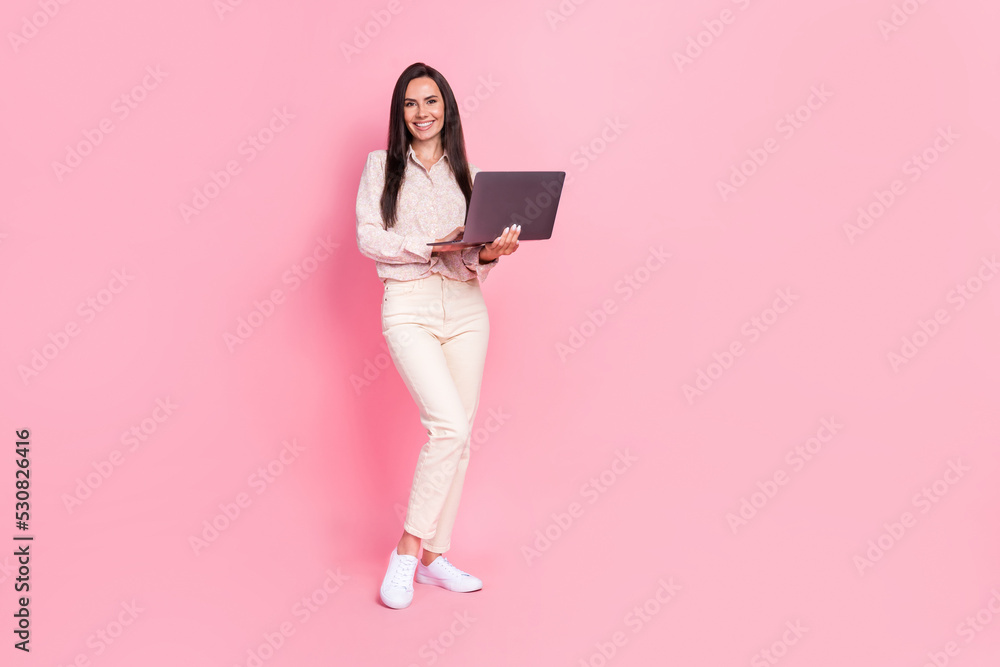 Full size photo of positive lady assistant using device modern technology isolated on pastel color background Full size photo of positive lady assistant using device modern technology isolated on pastel color background