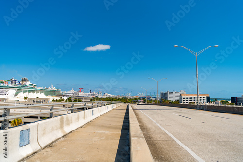 roadway with dock on the side and blue sky
