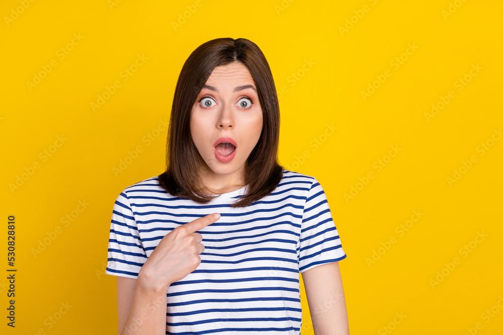Photo portrait of cute young woman point self shocked accused cant believe dressed trendy striped look isolated on yellow color background - obrazy, fototapety, plakaty 