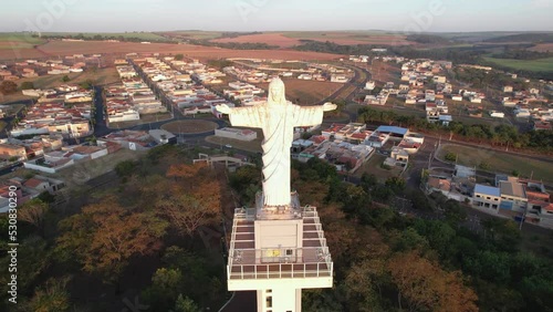 Sertaozinho, São Paulo / Brazil - Circa june 2022: Aerial image of the city of Sertaozinho, SP. Christ the Redeemer monument of the city, way of faith photo