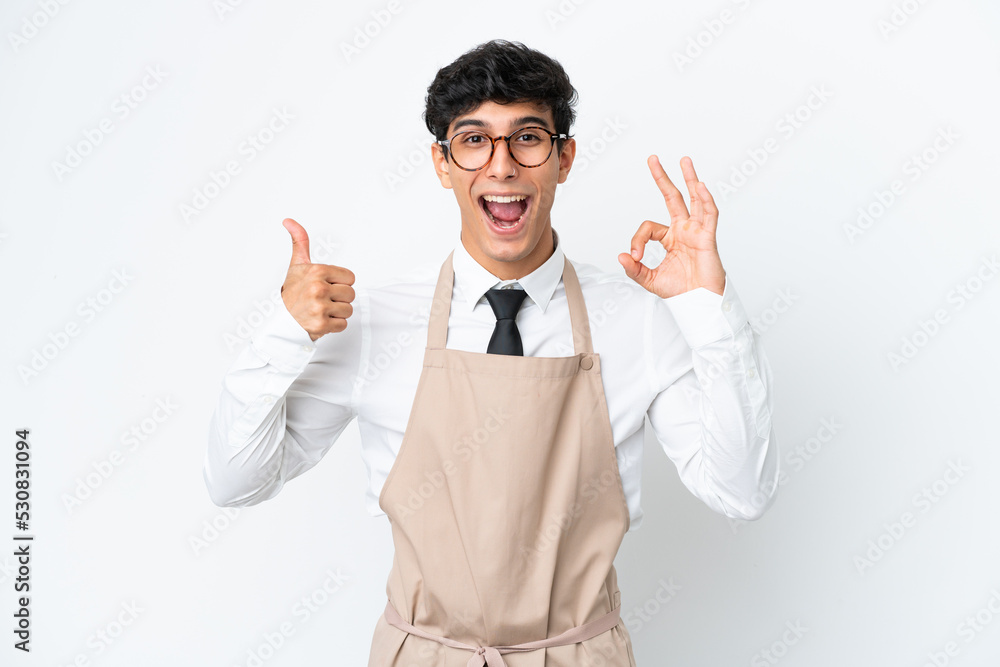 Restaurant Argentinian waiter isolated on white background showing ok sign and thumb up gesture Restaurant Argentinian waiter isolated on white background showing ok sign and thumb up gesture
